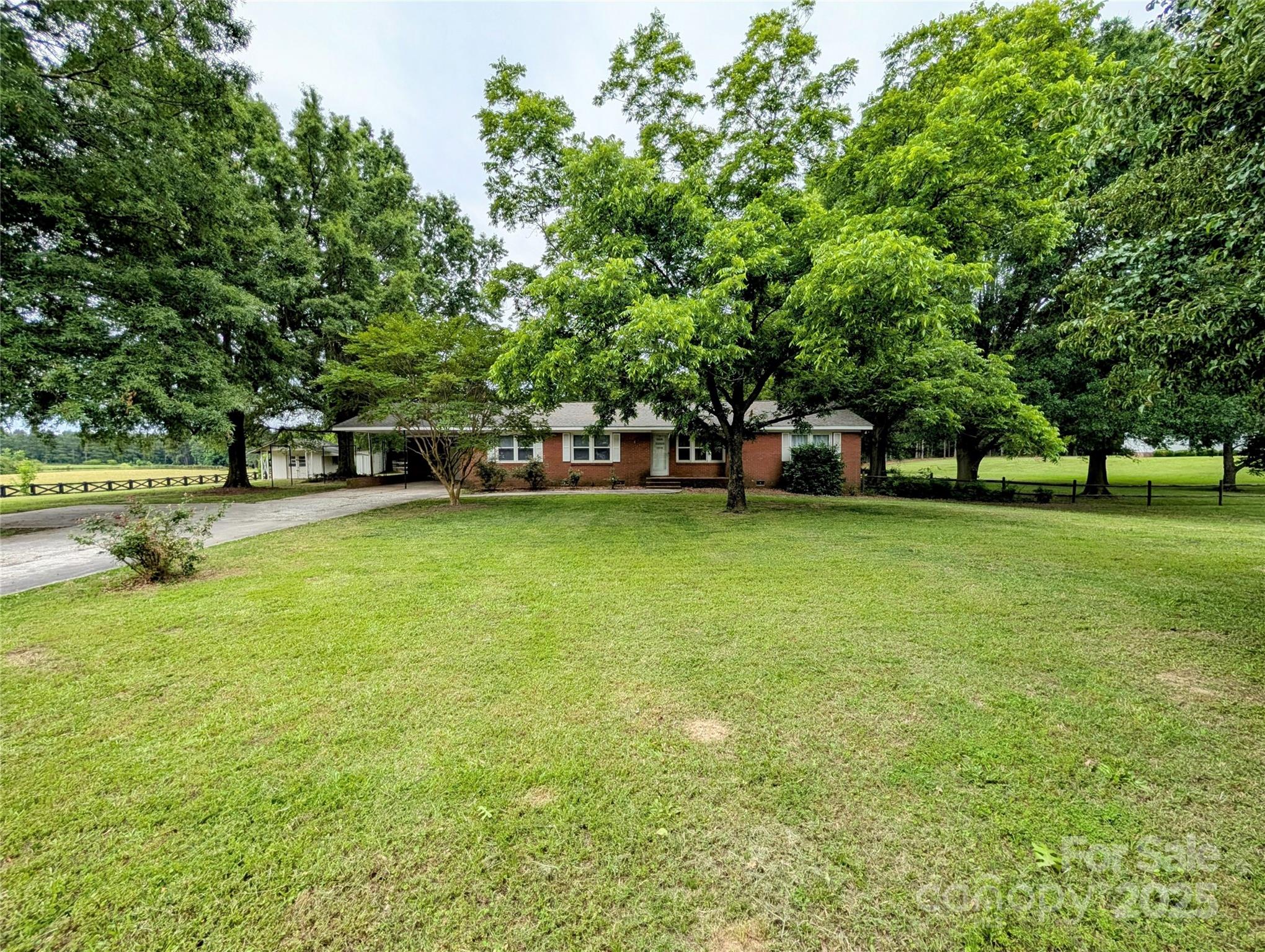 5628 White Store Road Wingate, NC 28174 - Photo 2 of 31 a view of a park with large trees