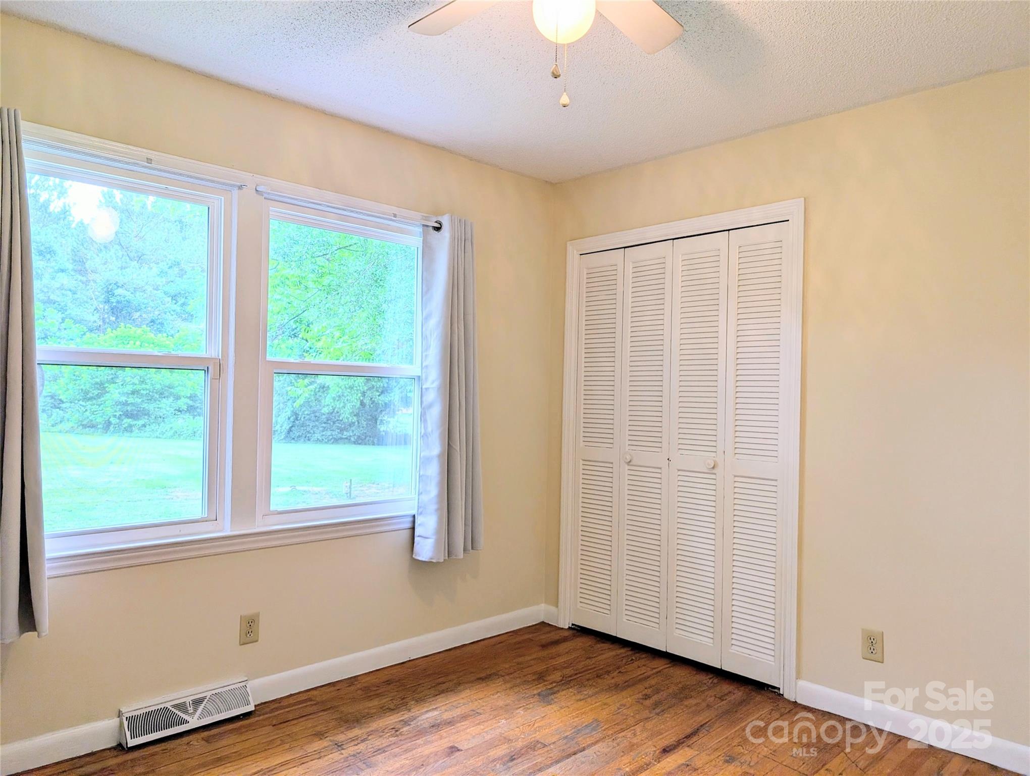 5628 White Store Road Wingate, NC 28174 - Photo 28 of 31 a view of an empty room with wooden floor and a window