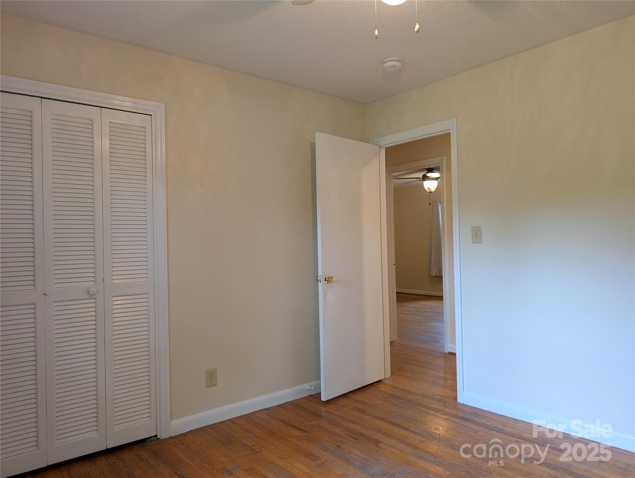5628 White Store Road Wingate, NC 28174 - Photo 29 of 31 a view of an empty room with wooden floor and closet