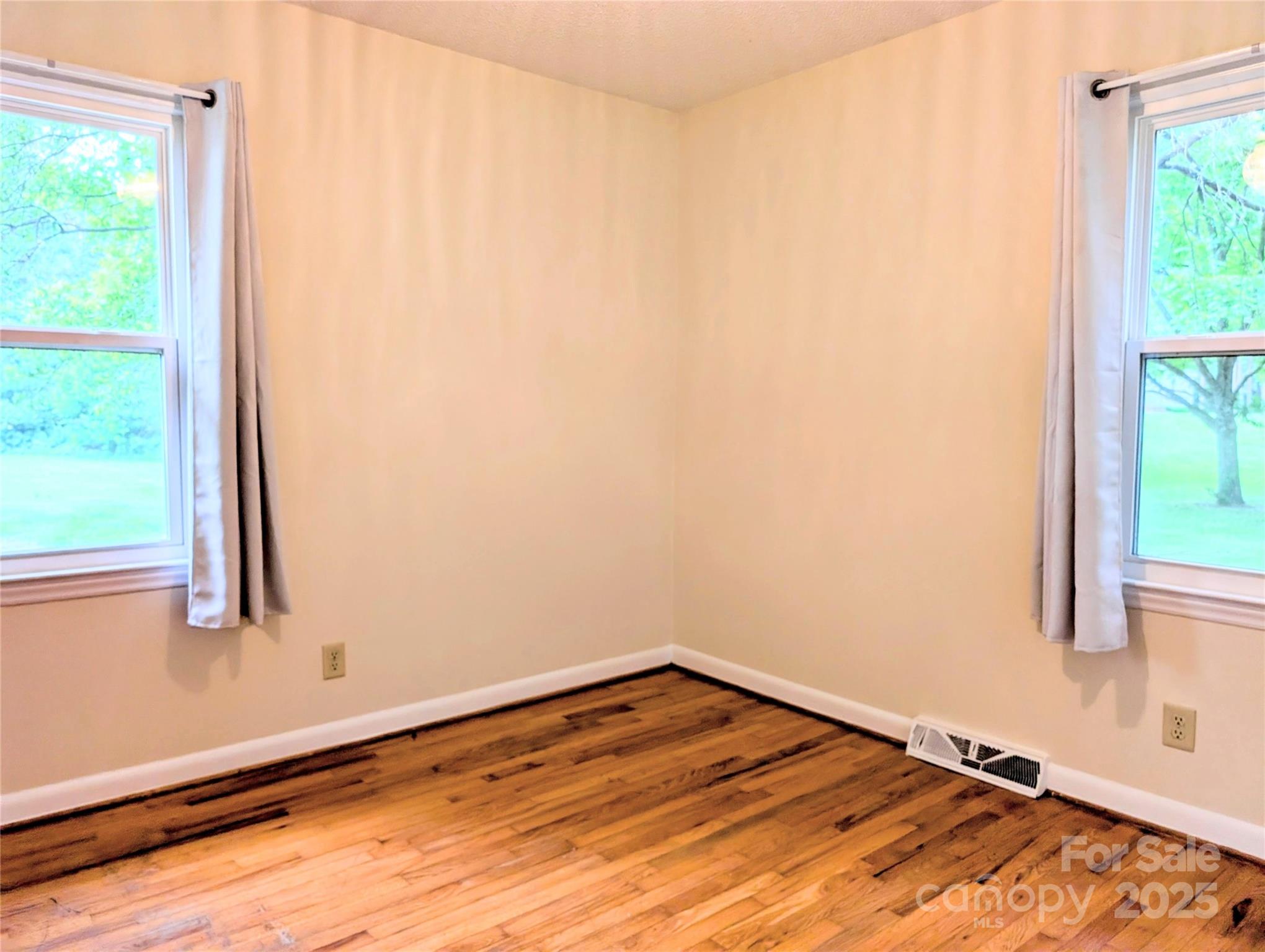 5628 White Store Road Wingate, NC 28174 - Photo 30 of 31 a view of a room with wooden floor and a window