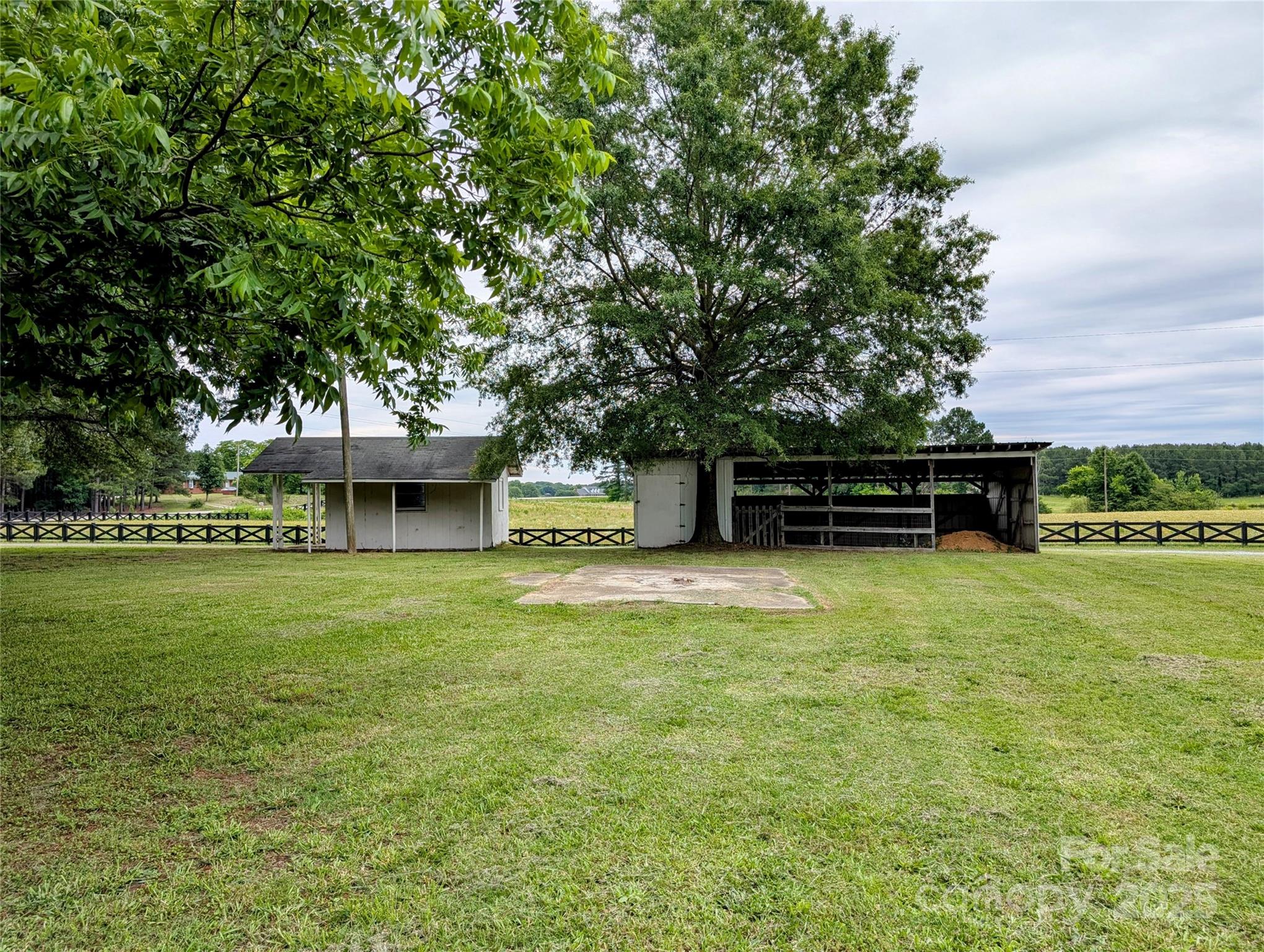 5628 White Store Road Wingate, NC 28174 - Photo 8 of 31 a view of a house with a garden