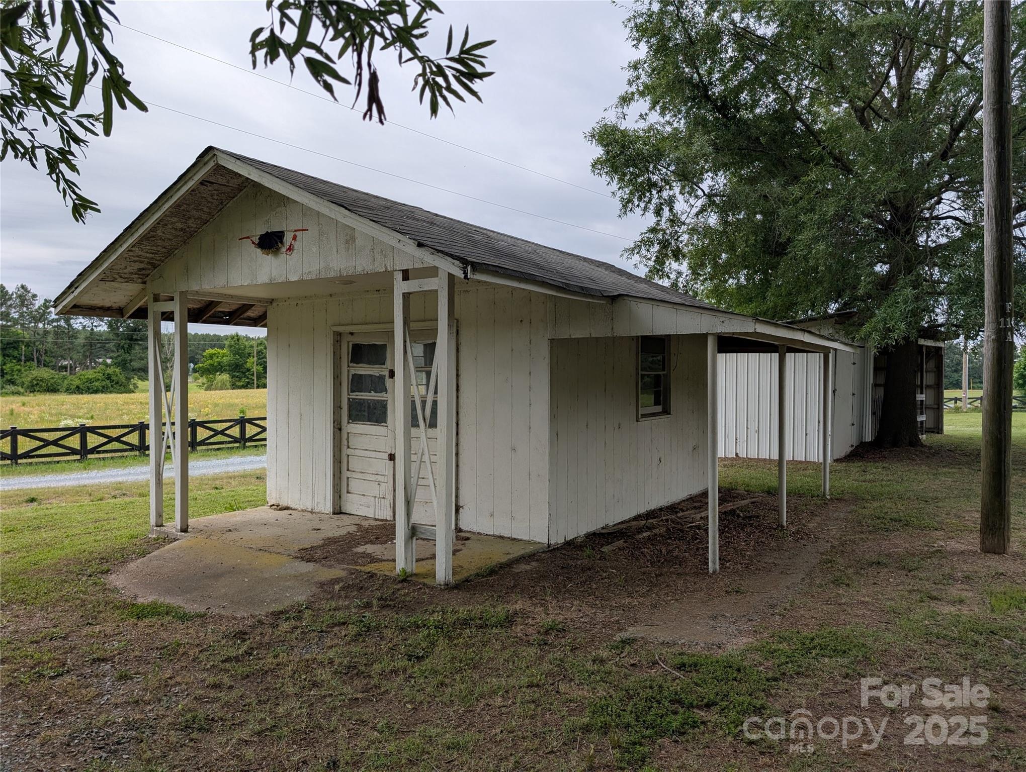 5628 White Store Road Wingate, NC 28174 - Photo 9 of 31 a view of a house with backyard and porch