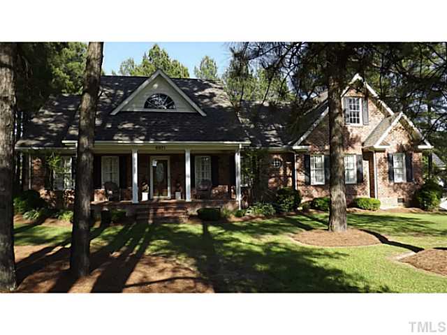 6671 Old Fairground Road Benson, NC 27504 - Photo 1 of 25 a view of a house with backyard porch and sitting area