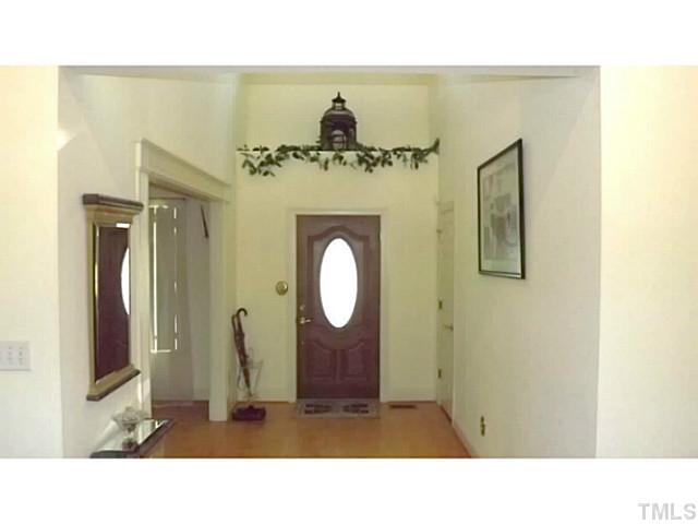 6671 Old Fairground Road Benson, NC 27504 - Photo 14 of 25 a living room with a mirror and a table