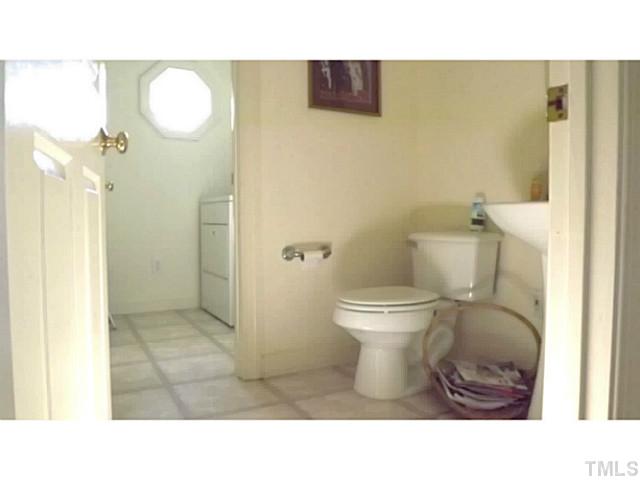 6671 Old Fairground Road Benson, NC 27504 - Photo 17 of 25 a bathroom with a toilet and a shower