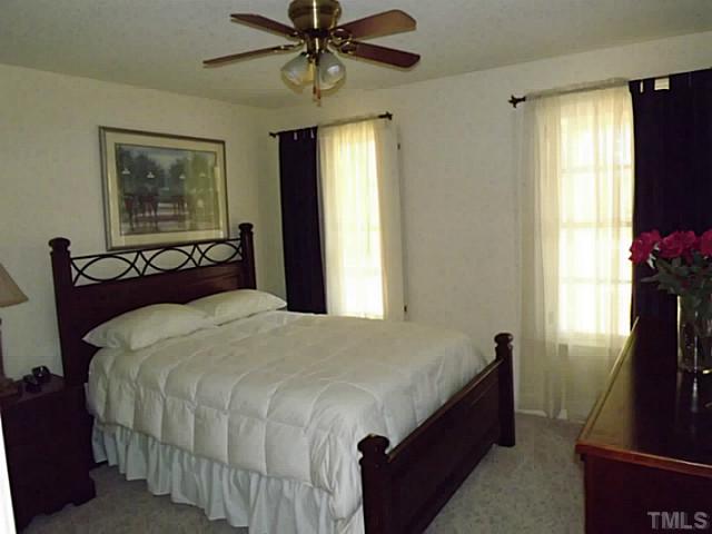 6671 Old Fairground Road Benson, NC 27504 - Photo 25 of 25 a bedroom with a bed and a window