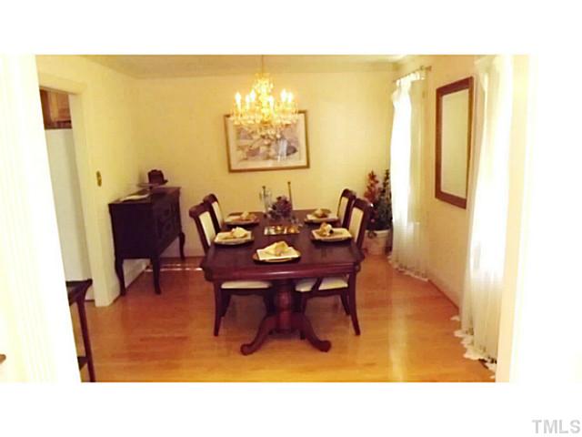 6671 Old Fairground Road Benson, NC 27504 - Photo 6 of 25 a living room with furniture and a table