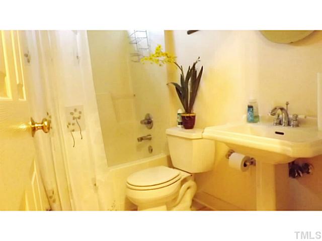 6671 Old Fairground Road Benson, NC 27504 - Photo 10 of 25 a bathroom with a sink and a mirror
