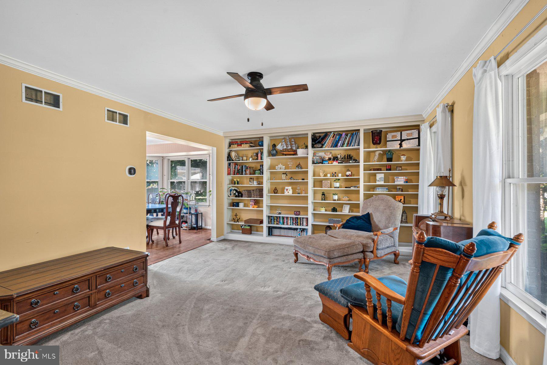 49 Rockland Road Westminster, MD 21158 - Photo 36 of 66 a living room with furniture a flat screen tv and a large window