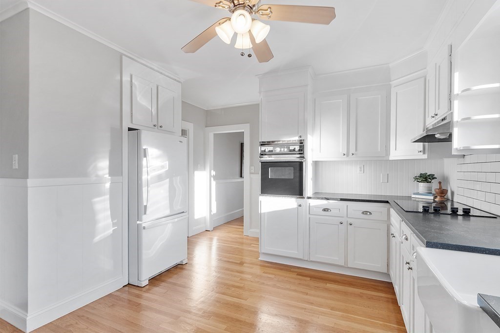 10 Victoria Road, Unit 2 Arlington, MA 02474 - Photo 15 of 28 a kitchen with cabinets a sink and appliances