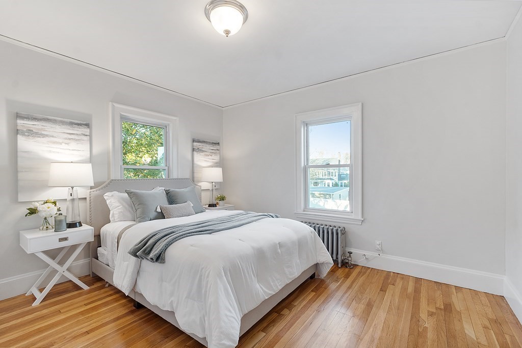 10 Victoria Road, Unit 2 Arlington, MA 02474 - Photo 19 of 28 a bedroom with a bed and a window
