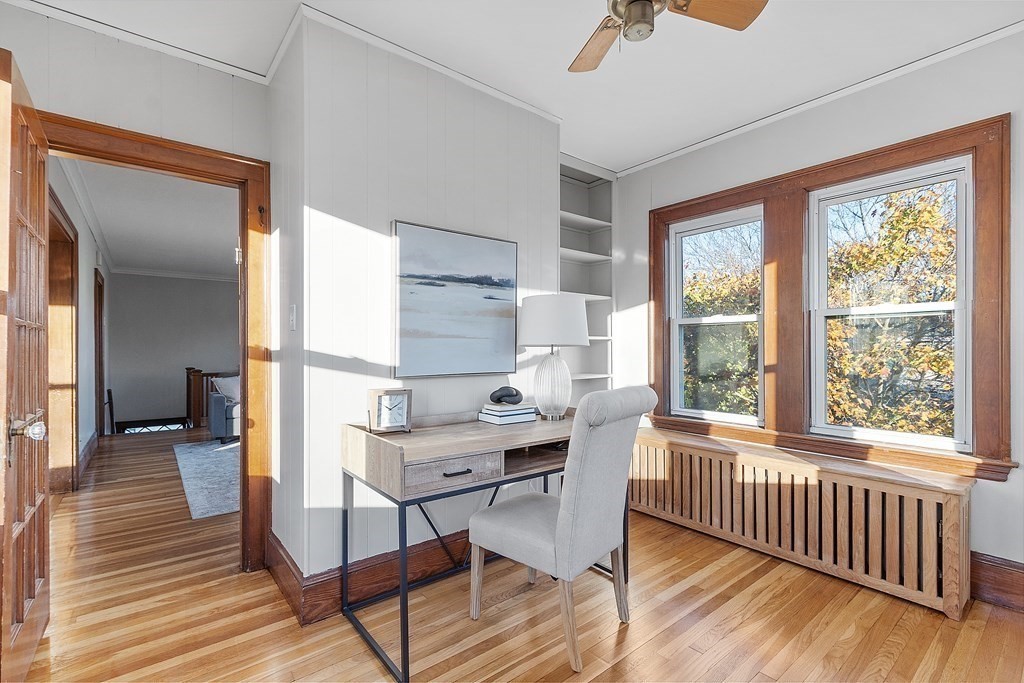 10 Victoria Road, Unit 2 Arlington, MA 02474 - Photo 7 of 28 a view of a workspace with furniture and a window