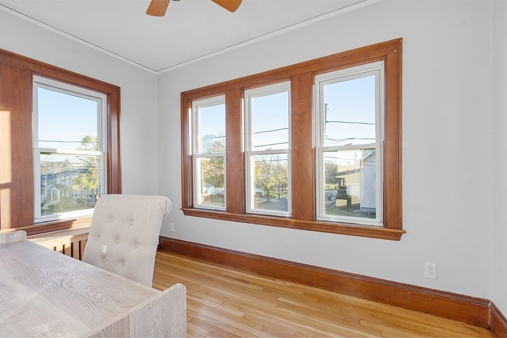 10 Victoria Road, Unit 2 Arlington, MA 02474 - Photo 8 of 28 a living room with furniture and a window