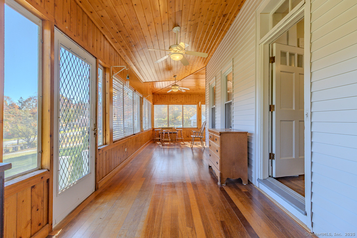 a view of a house with wooden floor and iron stairs