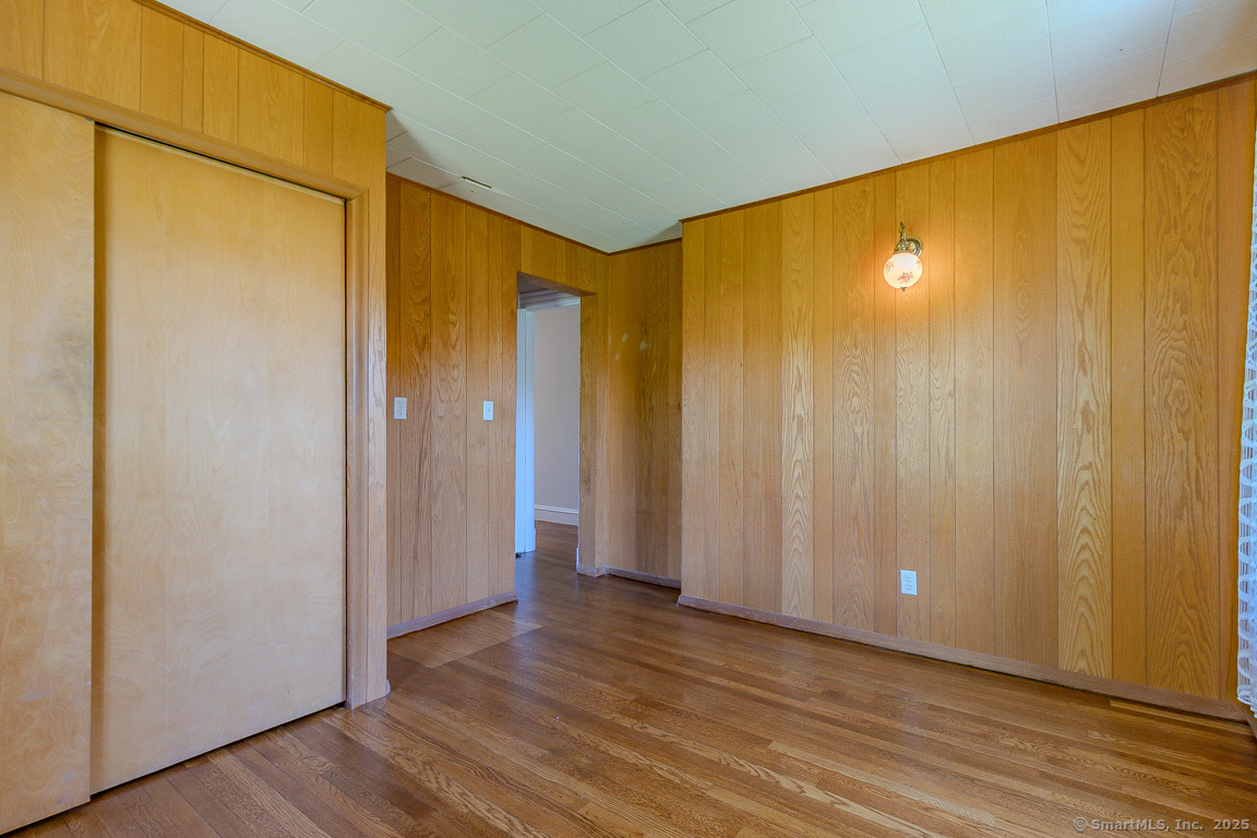 1152 Worthington Ridge Berlin, CT 06037 - Photo 12 of 40 a view of an empty room with wooden floor and a window