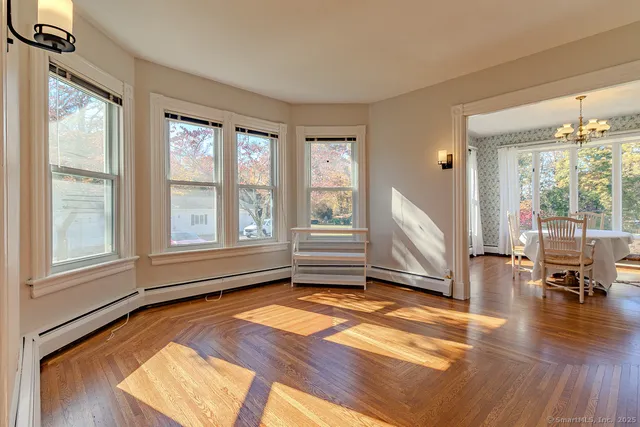 a view of a livingroom with furniture and hardwood floor