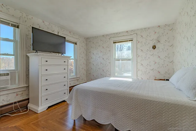 a bedroom with a bed and a walk in closet