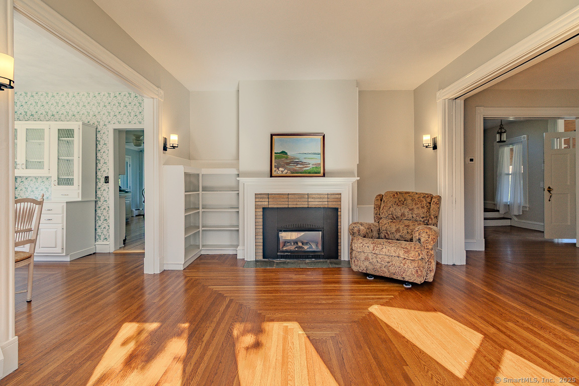 1152 Worthington Ridge Berlin, CT 06037 - Photo 22 of 40 a living room with furniture and a fireplace