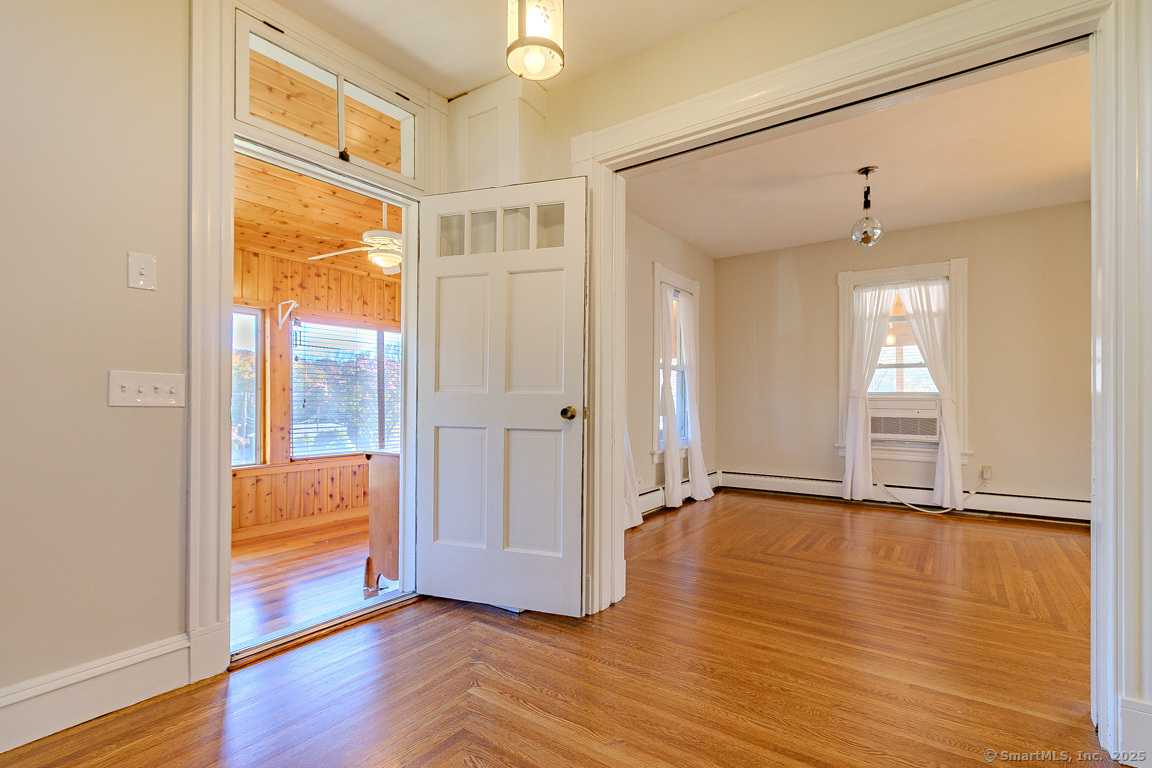 1152 Worthington Ridge Berlin, CT 06037 - Photo 26 of 40 a view of an empty room with wooden floor and a window