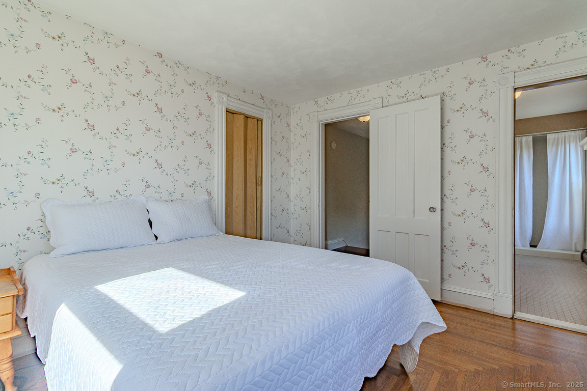 1152 Worthington Ridge Berlin, CT 06037 - Photo 30 of 40 a bedroom with a bed and a walk in closet