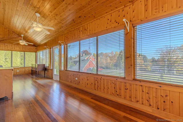 a view of a house with wooden floor and iron stairs