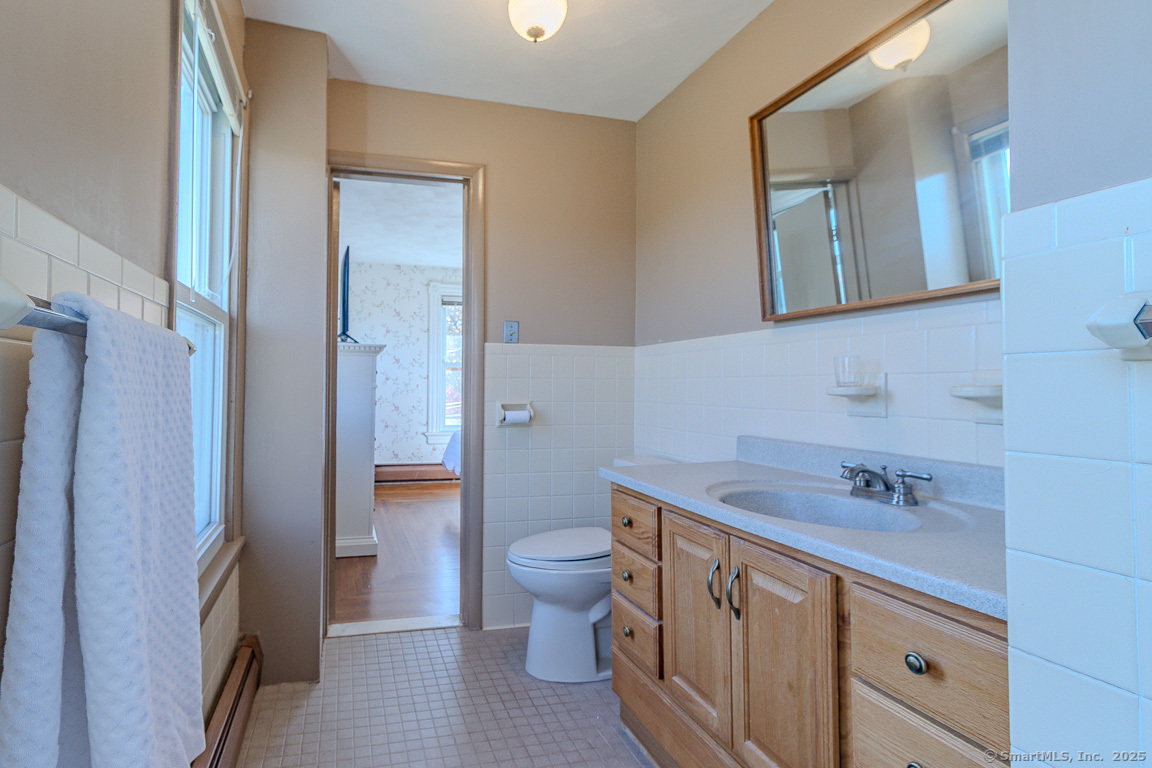 1152 Worthington Ridge Berlin, CT 06037 - Photo 32 of 40 a bathroom with a sink a toilet and shower