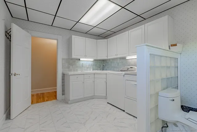 a utility room with dryer and washer