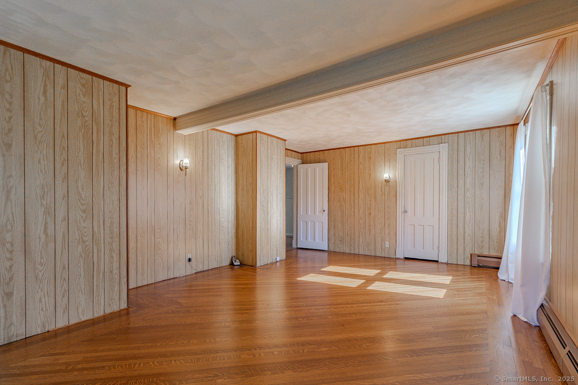 1152 Worthington Ridge Berlin, CT 06037 - Photo 34 of 40 a view of an empty room with wooden floor