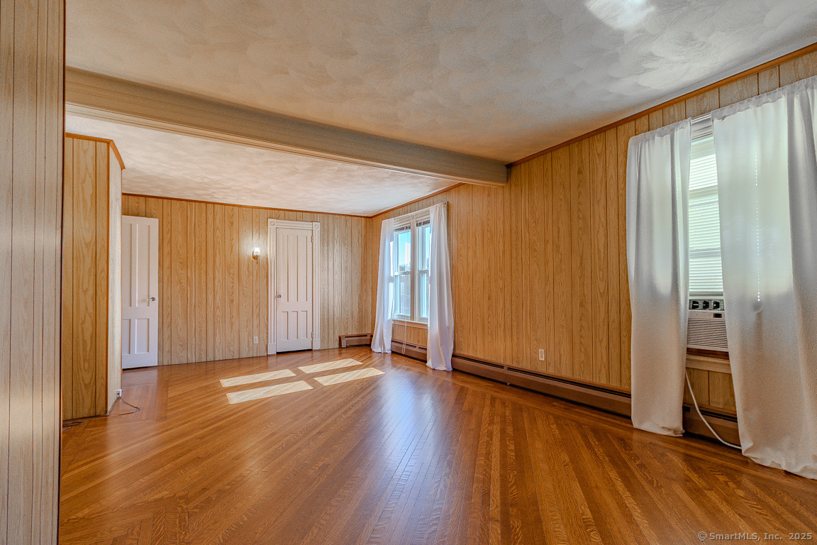 1152 Worthington Ridge Berlin, CT 06037 - Photo 35 of 40 a view of an empty room with wooden floor and a window