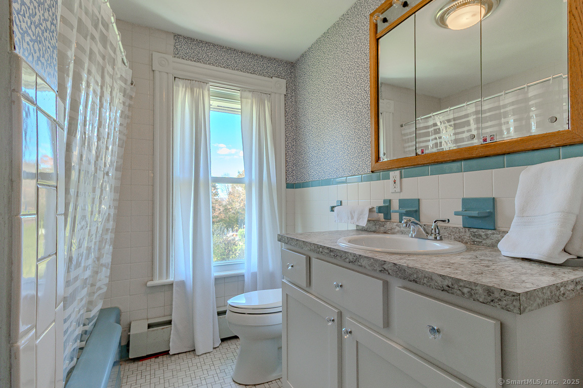 1152 Worthington Ridge Berlin, CT 06037 - Photo 38 of 40 a bathroom with a granite countertop sink a toilet and a mirror