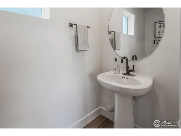 a bathroom with a sink and mirror