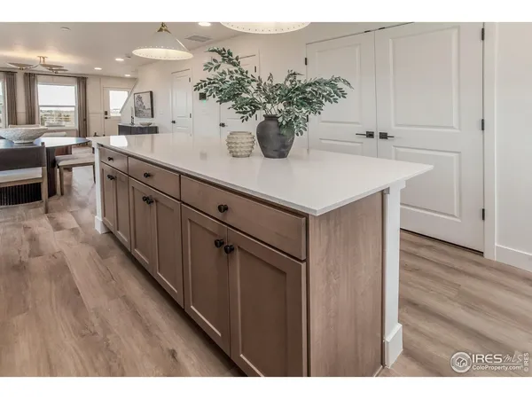 a view of a kitchen cabinets and wooden floor