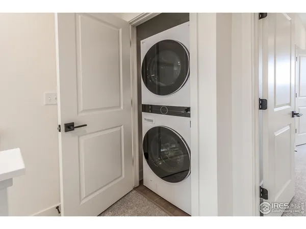 a view of a hallway with washer and dryer