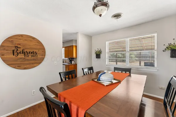 a dining room with furniture and window