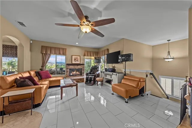 a spacious bedroom with a bed and a fireplace