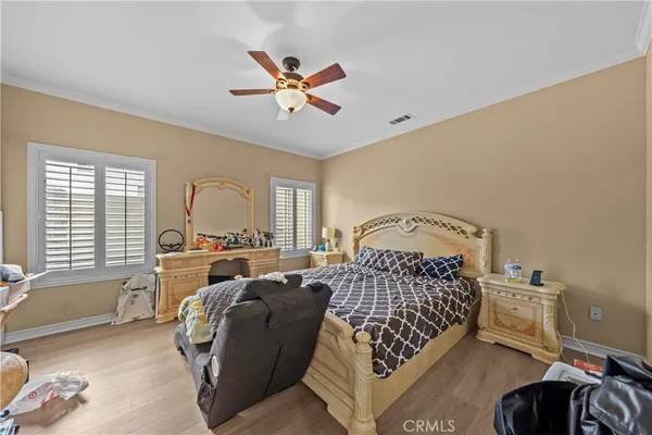 a bed room with a bed and a chair