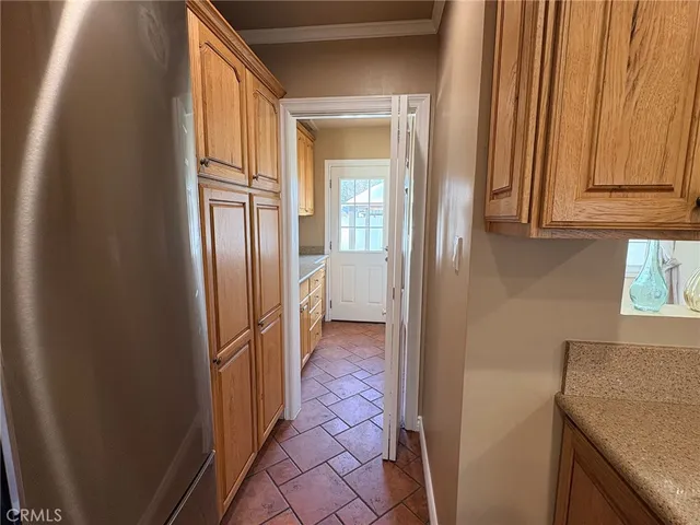 a view of a kitchen from the hallway