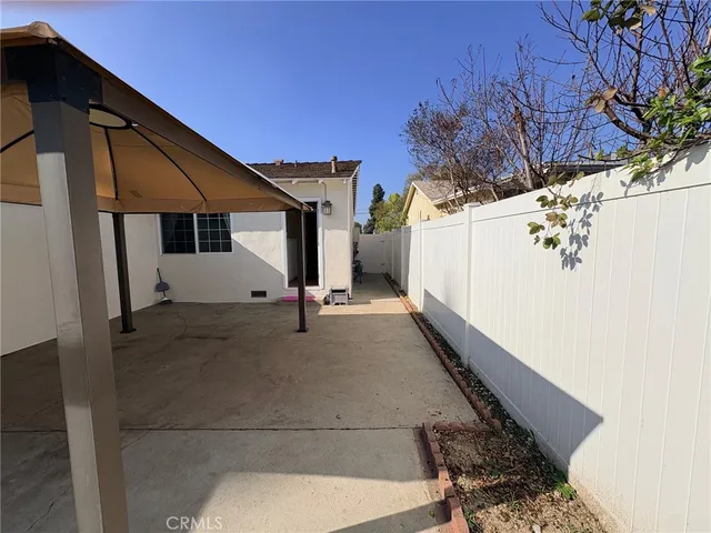a view of a house with a tree