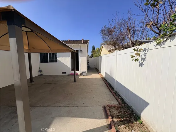 a view of a house with a tree
