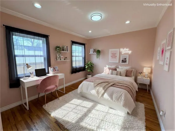 a bedroom with a bed and a desk