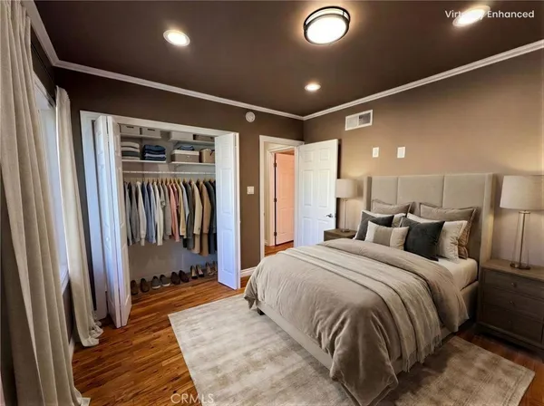 a bedroom with a bed and a walk in closet