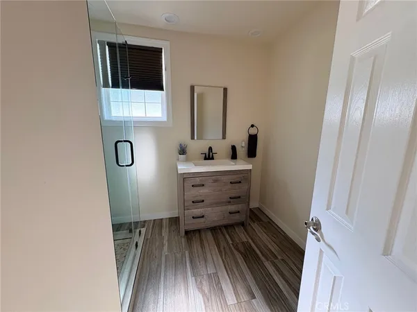 a bathroom with a sink and mirror