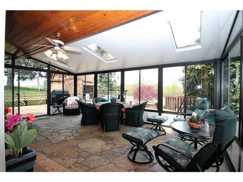 3792 Cedar Ridge Road Allison Park, PA 15101 - Photo 11 of 22 Sunroom. 3 walls of windows grace the large sunroom