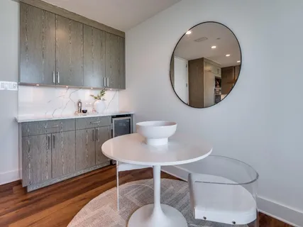 a bathroom with a toilet a sink and a mirror