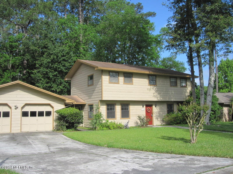 11440 Scott Mill Road Jacksonville, FL 32223 - Photo 1 of 26 a front view of house with yard and green space
