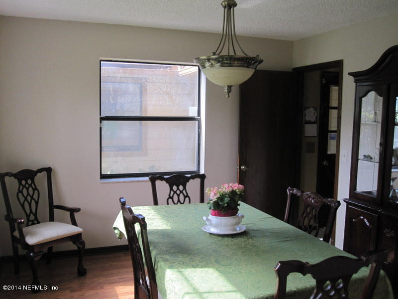 11440 Scott Mill Road Jacksonville, FL 32223 - Photo 13 of 26 a view of a dining room with furniture