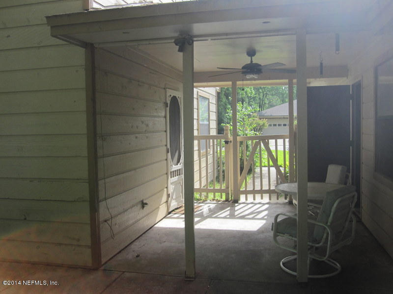11440 Scott Mill Road Jacksonville, FL 32223 - Photo 19 of 26 a view of entry way with wooden door