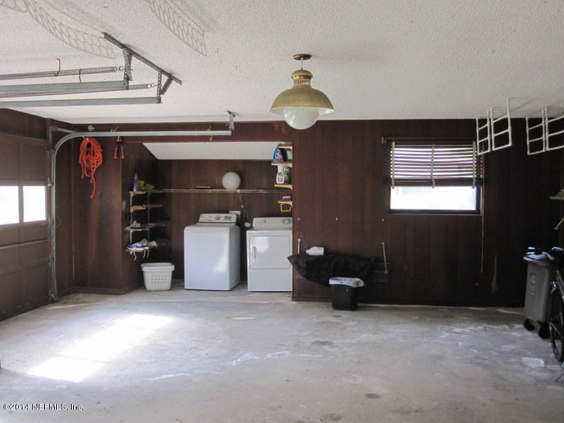11440 Scott Mill Road Jacksonville, FL 32223 - Photo 20 of 26 a view of a livingroom with furniture and closet