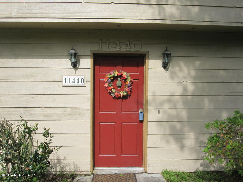 11440 Scott Mill Road Jacksonville, FL 32223 - Photo 2 of 26 a front view of a house with a door and a shower