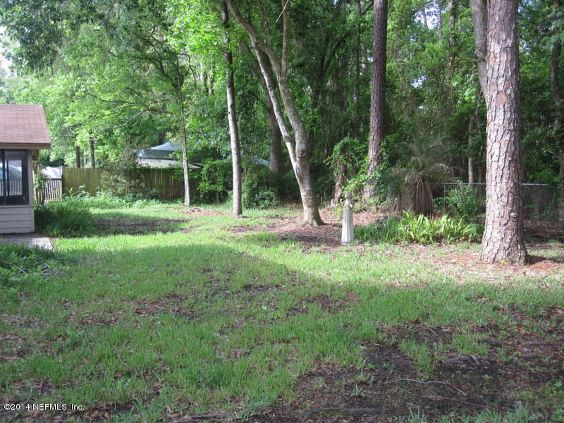 11440 Scott Mill Road Jacksonville, FL 32223 - Photo 24 of 26 a view of outdoor space with deck and yard